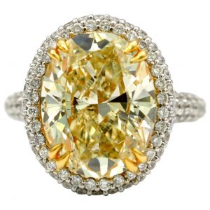 7.36 Carat EGL Fancy Light Yellow Oval SI2 with Pave Diamonds in 18 Karat Ring