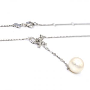 Necklace and earrings dangle diamond bow and pearl set 750